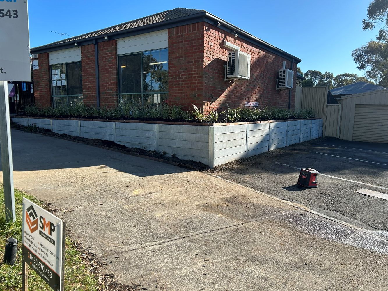 After — Commercial Curb Appeal: Modernizing Tired Retaining Walls